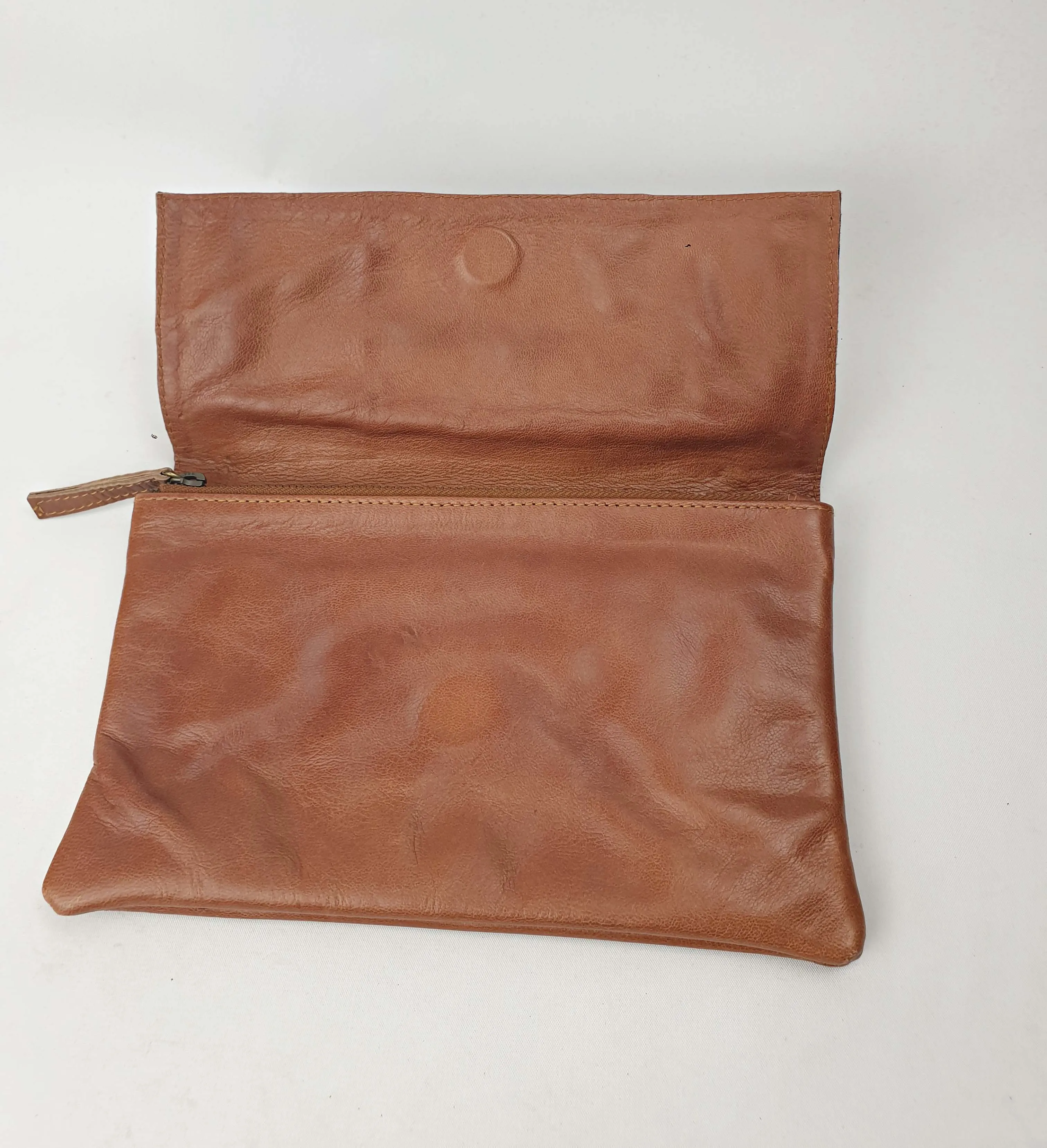 Little Traveller brown leather clutch with front fabric detail