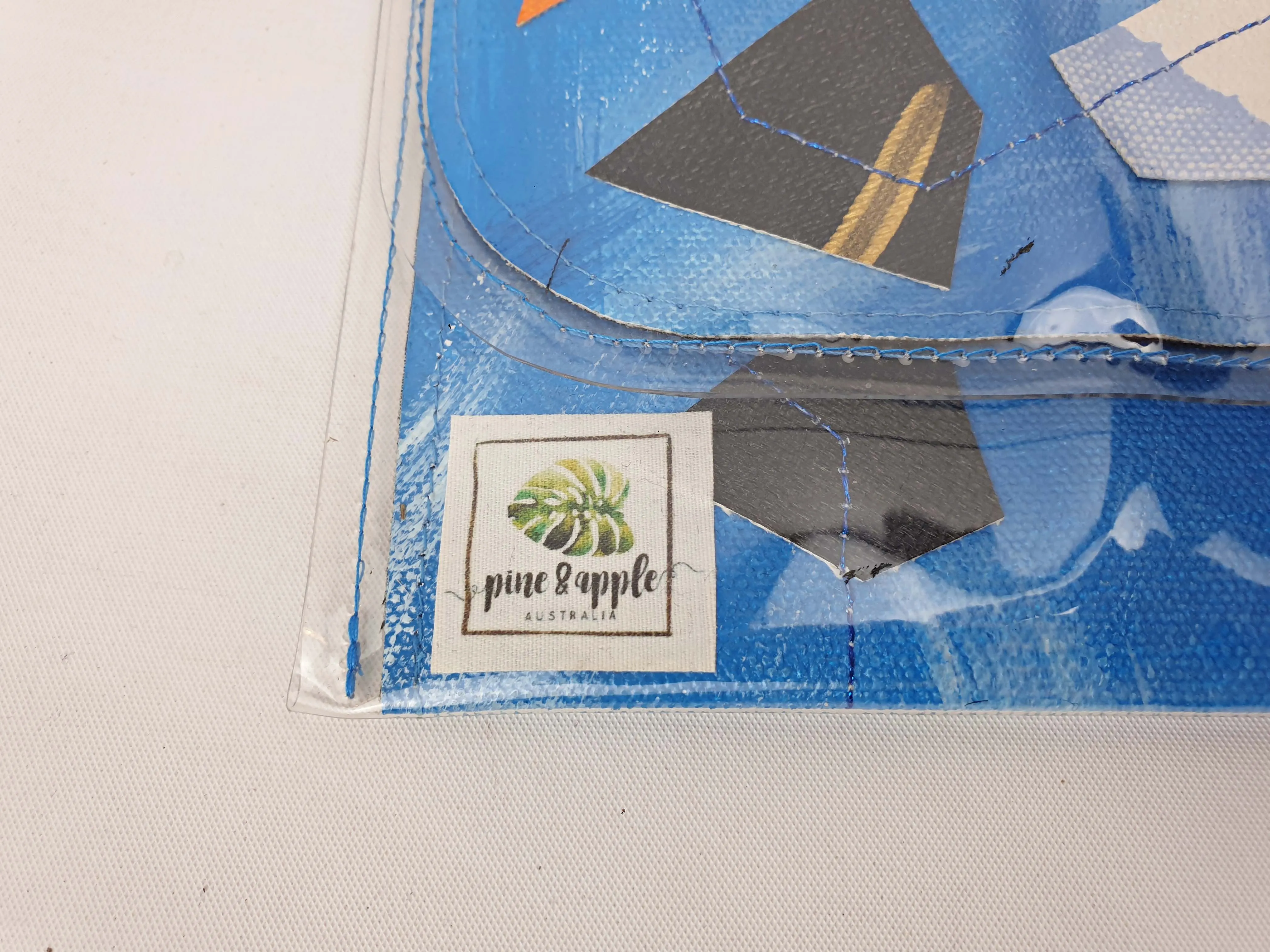 Pine & Apple blue plastic covered clutch